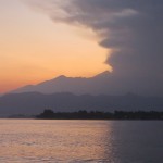 Mount Rinjani spewing ash before sunrise